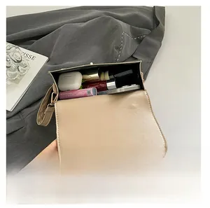 Interior view of minimalist crossbody bag showing storage capacity for daily essentials
