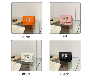 Mini square chain bags in orange pink white and black with silver metal bows