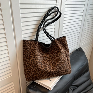 Large leopard print tote bag with black woven handles for chic autumn winter commuting