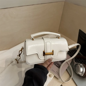 Minimalist white leather crossbody handbag with gold buckle and top handle for women