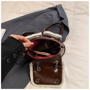 Brown faux leather mini backpack with white fleece trim and open interior view