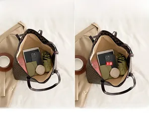 Detail view of large tote bag interior showing capacity for tablets and essentials