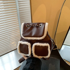 Retro brown leather backpack with white faux fur trim and silver chain drawstring