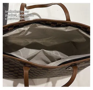 Detail of herringbone lining and internal pocket inside the brown checkered tote bag
