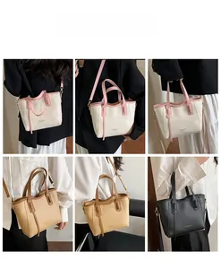 Detail showing versatile carrying ways for the French retro leather bucket tote bag