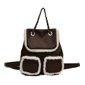 Brown vintage leather backpack for women with white faux fur trim and silver chain