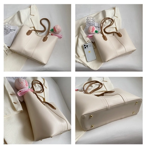 Detailed views of a beige tote bag featuring brown straps and bottom protective studs