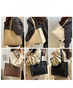 Vues détaillées d'un grand sac cabas en cuir avec coutures et logo imprimé
