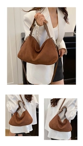 Detailansicht der großen braunen Wildledertasche mit weicher Textur und Trageriemen