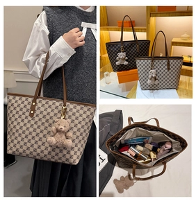 Detail view of large tote bag interior capacity and patterned leather texture
