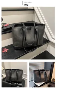 Detailed views of the large grey canvas tote bag with black leather trim and logo
