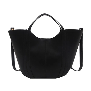 Minimalist black matte leather bucket bag with contrast stitching and adjustable strap