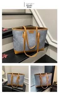 Macro view of khaki-blue felt tote bag with premium leather trim and fashion patch