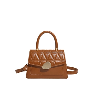 Brown quilted crossbody bag with crocodile embossing and a golden metallic clasp
