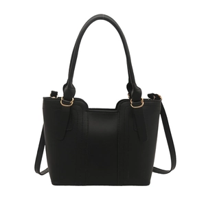 Elegant black faux leather tote bag with gold hardware and detachable shoulder strap