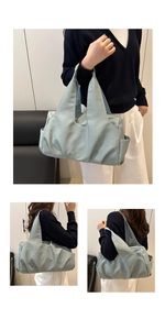 Close-up of light blue pleated hobo bag showing side pocket and soft fabric texture