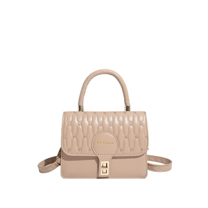 Elegant apricot quilted crossbody bag with golden hardware and fashion lettering detail