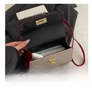 Detail view of large capacity bag interior with canvas and red leather patchwork