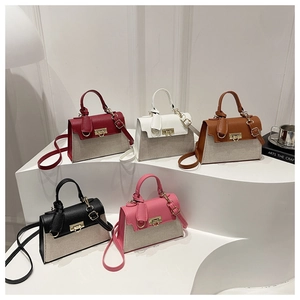 Collection of multi-color crossbody mini square bags on white geometric pedestals