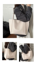 Detailed close-up showing the premium cream leather texture of this large tote bag