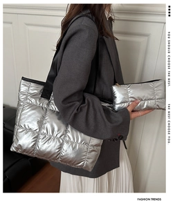 Silver quilted tote bag set with matching pouch and black wide strap on model