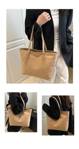 Detail view of large faux suede tote bag featuring adjustable straps and minimalist texture