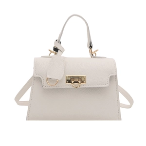 White lychee pattern leather handbag with gold lock and detachable strap in trapezoid shape