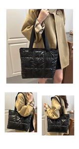 Detail of black quilted puffer tote bag showing waterproof fabric texture and stitching