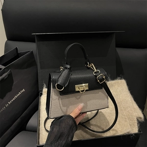 Elegant beige and black flap handbag with gold metal lock and gift packaging set