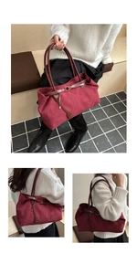 Macro view of burgundy suede tote bag featuring brown leather straps and gold buckle detail