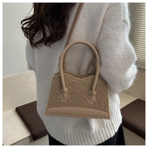 Chic beige plush faux fur handbag styled with a cozy knit sweater for winter outfits