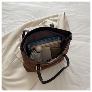 Open view of brown suede tote bag showing large capacity for tablet and daily items
