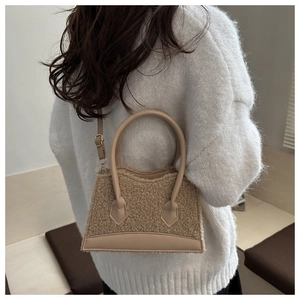 Beige faux fur tote bag with leather trim worn by model in cozy winter setting