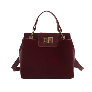 Large burgundy suede crossbody handbag with minimalist design and gold metal buckle