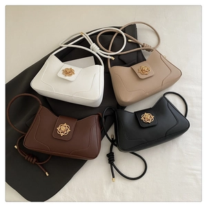 Detail view of four stylish square handbags featuring vintage golden floral clasps