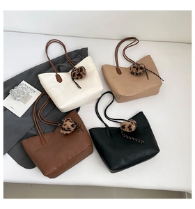 Collection of large tote bags in white, beige, coffee, and black with leopard charms
