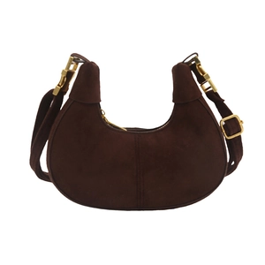 Deep brown suede moon hobo bag with minimalist design and gold hardware on white background