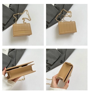 Detailed views showing the vertical embossed texture and gold chain of the khaki crossbody bag