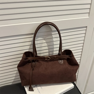 Retro dark brown suede tote bag with slim shoulder straps and decorative buckle closure