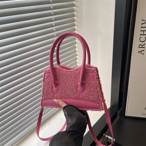 Pink plush faux fur handbag with leather trim and top handle for women's fashion