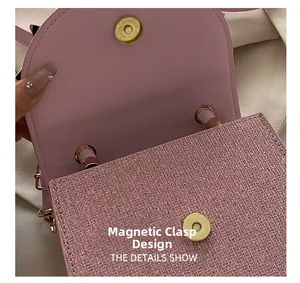 Close-up of pink sequin evening bag featuring a secure magnetic buckle closure