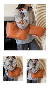 Detail of caramel faux leather tote bag with matching pouch and gold hardware accents