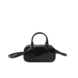 Glossy black patent leather Boston bag with top handles and adjustable shoulder strap