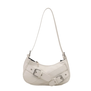 Retro ivory hobo shoulder bag with stylish decorative buckle straps and metal details