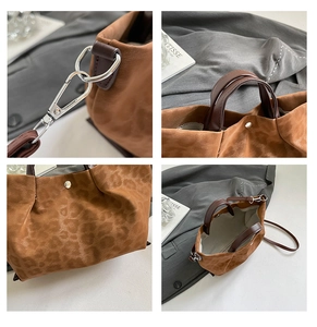 Detail view of leopard print tote featuring metal hooks and magnetic closure