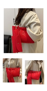 Detail of red monogram tote bag set with gold chain strap and mini envelope pouch