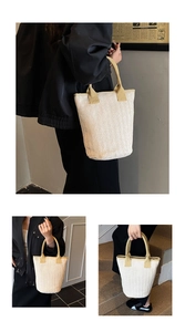 Detail of woven tote bag featuring cream body and light brown handles for daily use