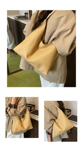 Close-up of a large wheat-ear woven tote bag with casual bohemian texture for fall style