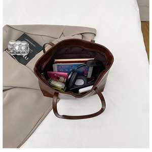 Interior view of large capacity tote bag showing zipper pocket and spacious storage