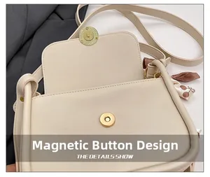 Close-up of cream PU shoulder bag with magnetic snap closure and decorative silk scarf